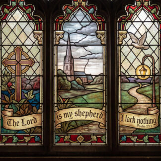 Stained-glass triptych featuring a central church steeple, a cross on the left, and a white dove on the right, with Psalm 23 verse banners below.